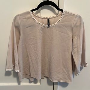 Beige top with lace detail on collar and sleeves